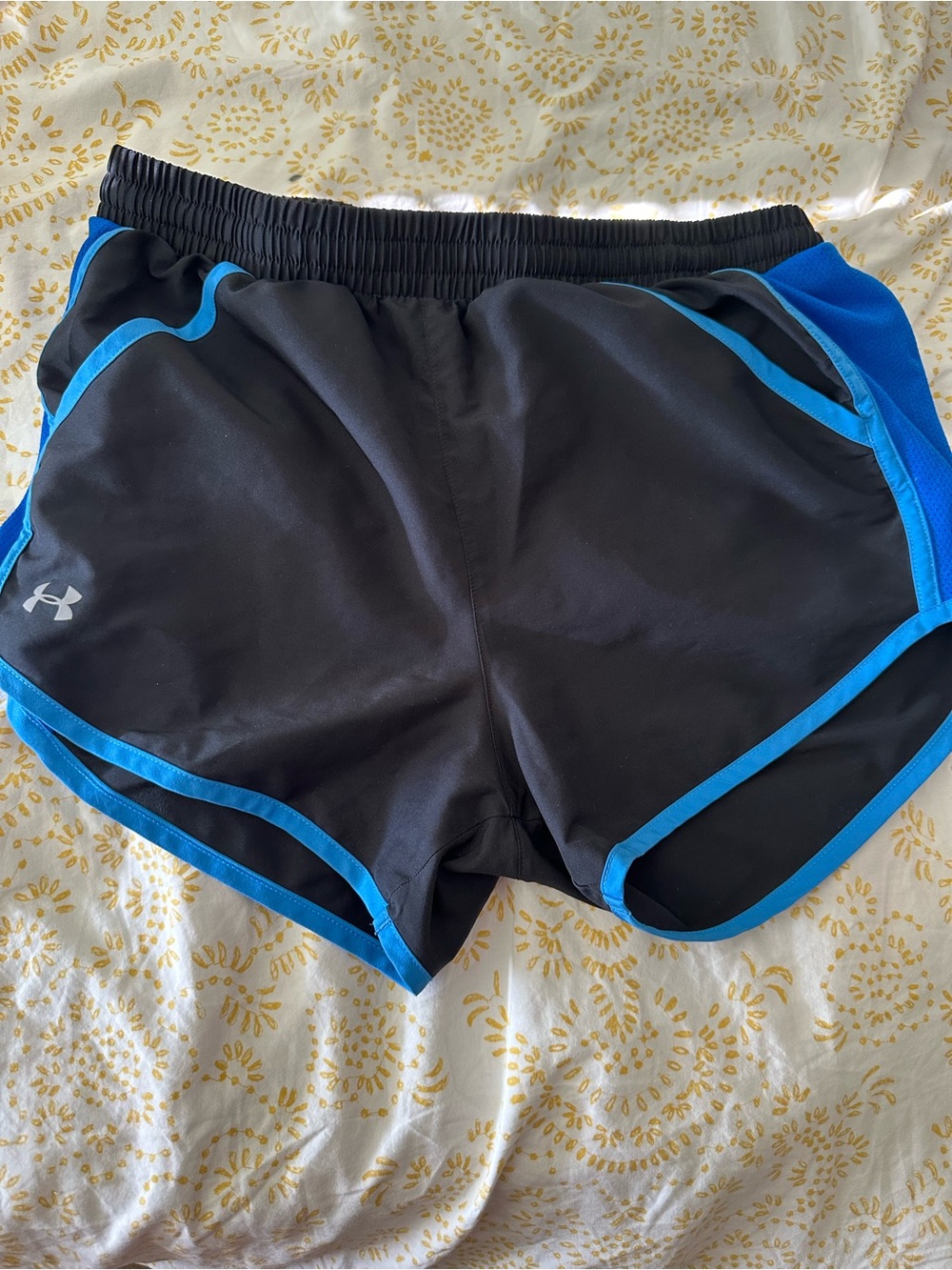 Black and blue Under Armour gym shorts